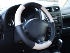 Pokrowce samochodowe, Pokrowce na kierownice skórzane w kolorze czarno - beżowy,.